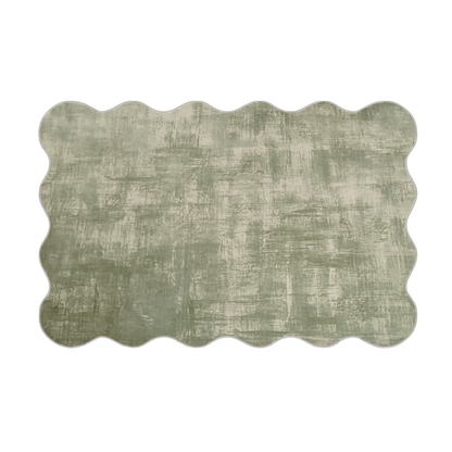 Full view of a green scalloped-edge rug on a white background