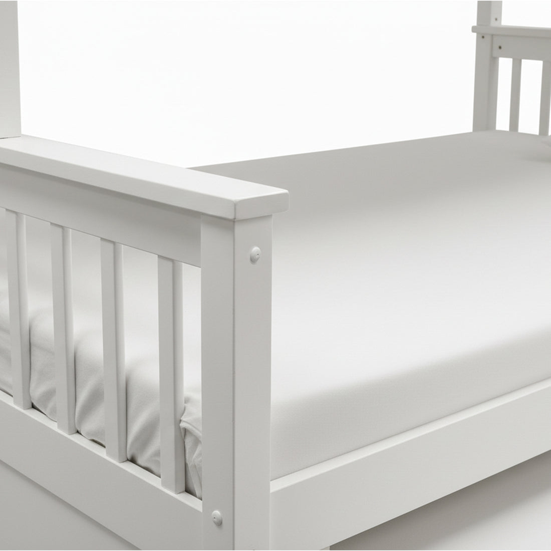 Close-up of bed frame corner and side rails on white background
