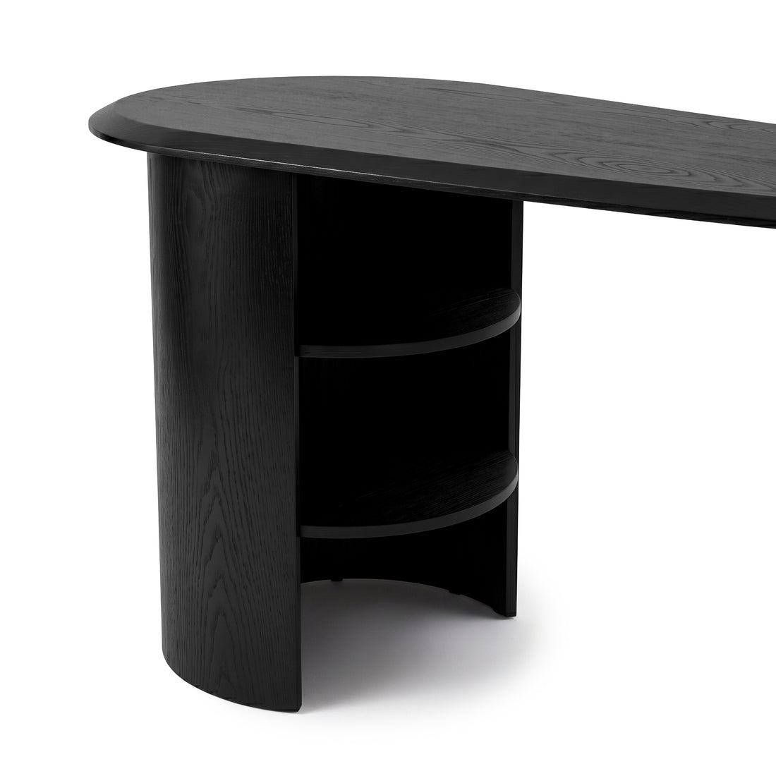 Black desk with oval top and shelving on a white background