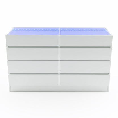 Modern white chest of drawers with eight handle-less drawers and blue-tinted glass top on white background