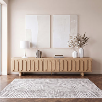 Light wood sideboard styled in a modern living room