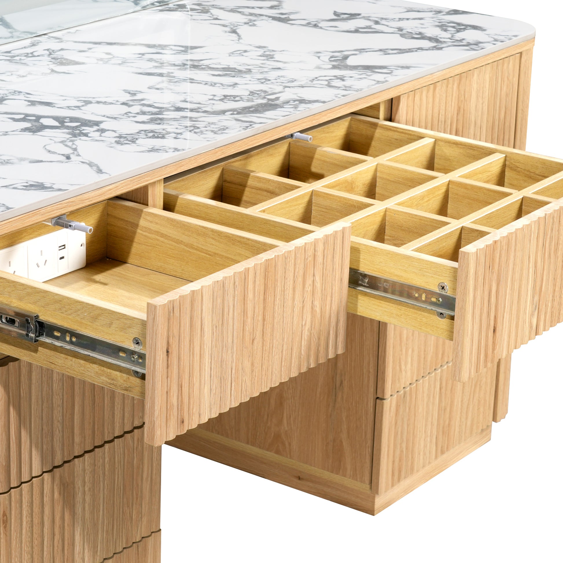 Open drawers and tabletop section of a modern vanity on a white background