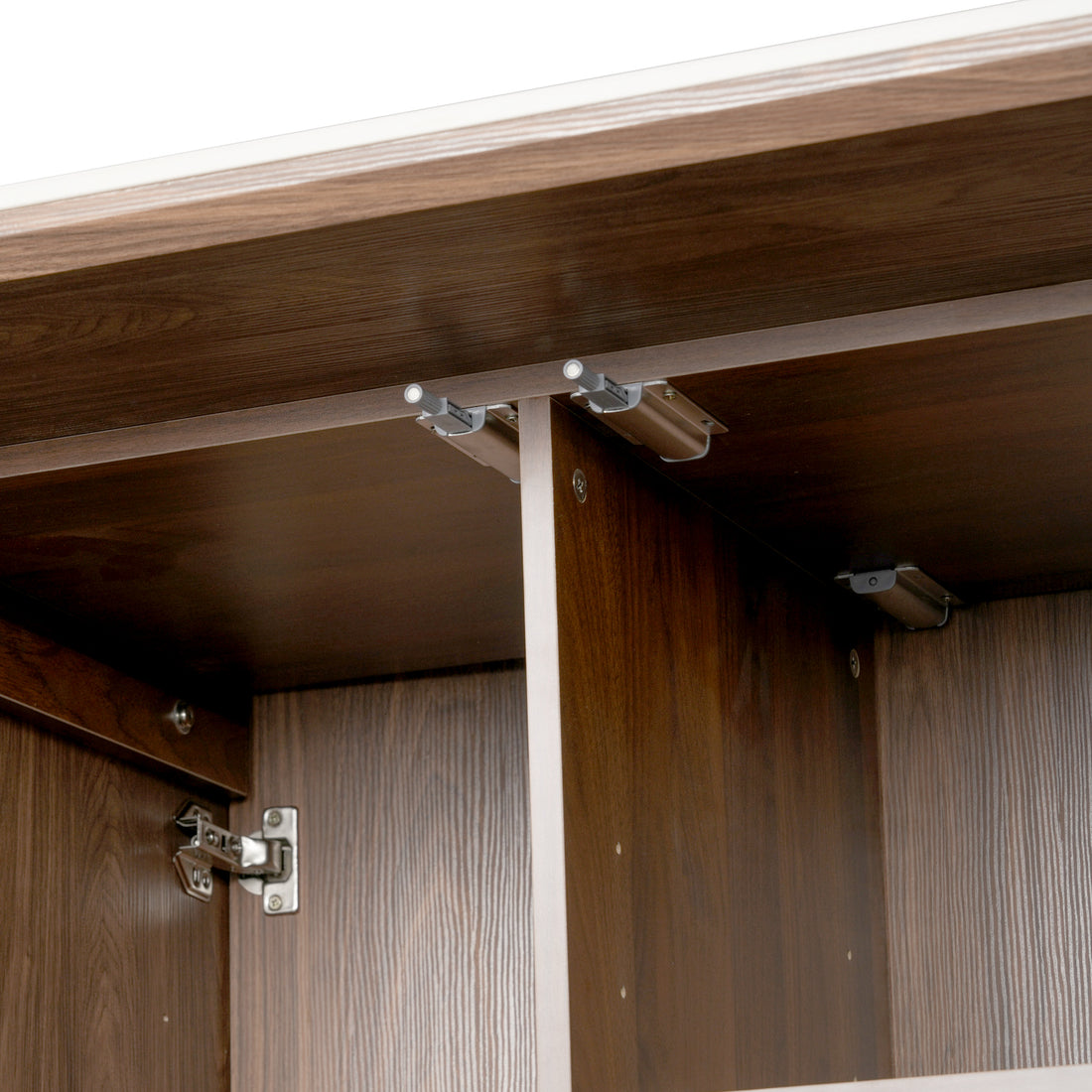 Close-up of the interior corner and hardware of a wooden cabinet