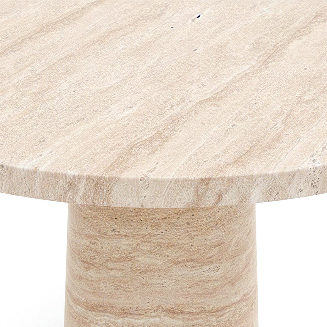 Close-up of round stone table edge and base