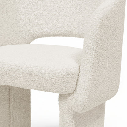 Avela Bouclé Fabric Curved Accent Armchair in Cream White, featuring a textured bouclé seat, curved backrest with cut-out, and visible arm/leg structure, designed for cozy, modern comfort.