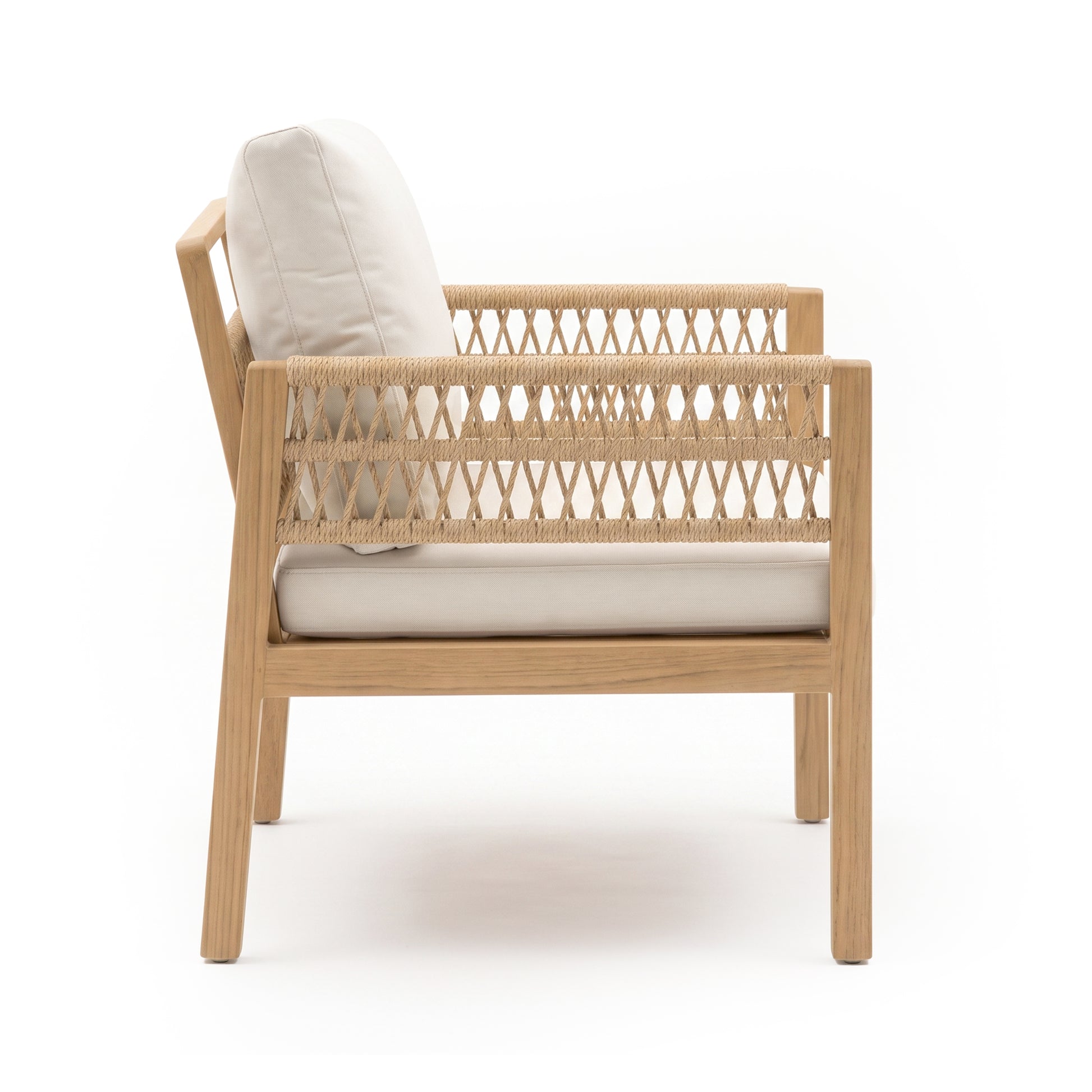 Side view of a wooden armchair with woven sides and cushions on white background