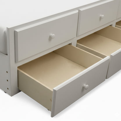 Side view of white storage drawers of bunk bed on white background