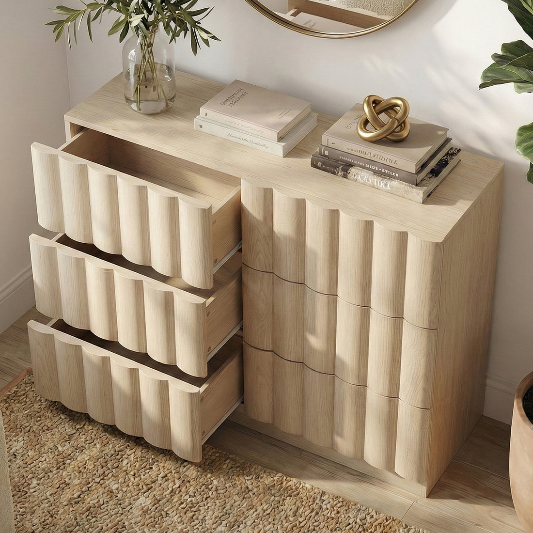 Three-drawer wave-textured light wood dresser with decorative vignette in room