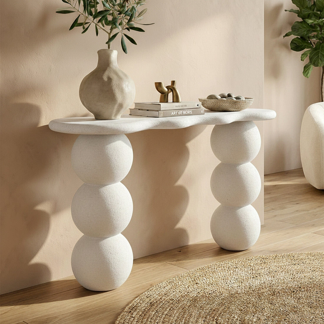 White console table in a bright room with wooden floor, rug, and decorative accessories