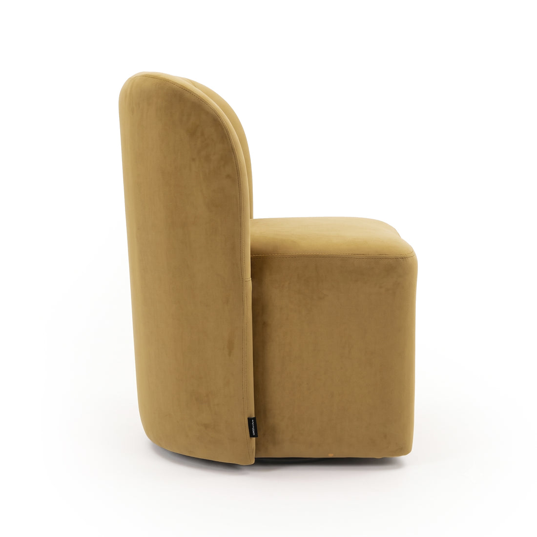 Side view of a mustard brown upholstered chair on white background