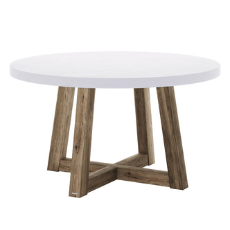 Magnus Hardwood and Concrete Outdoor Dining Table features a smooth white round concrete top on an “X”-style acacia wood base, designed for stylish and sturdy alfresco dining.