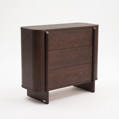 Modern dark wood dresser with three drawers on a white background