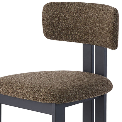 Haleo Curved Boucle Dining Chair Set of 2 in Rust Brown features a dark matte frame with padded seat and narrow backrest, upholstered in textured bouclé fabric, highlighting modern design and comfort.