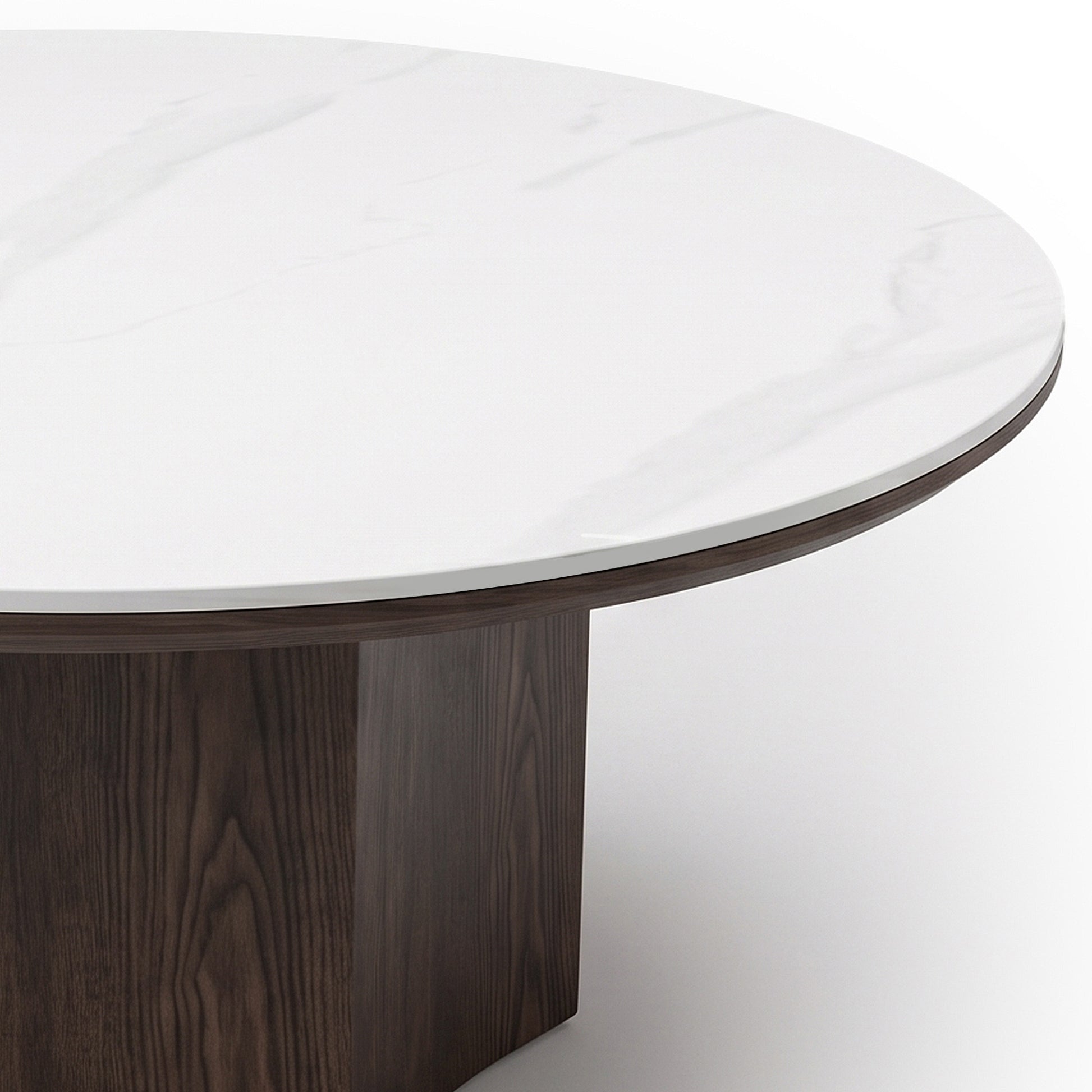 Close-up of a round table showing the tabletop and partial base on a white background.