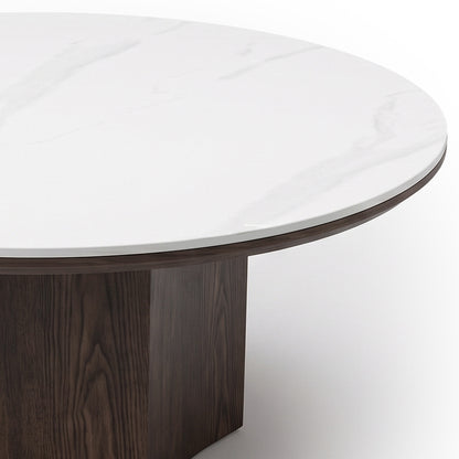 Close-up of a round table showing the tabletop and partial base on a white background.