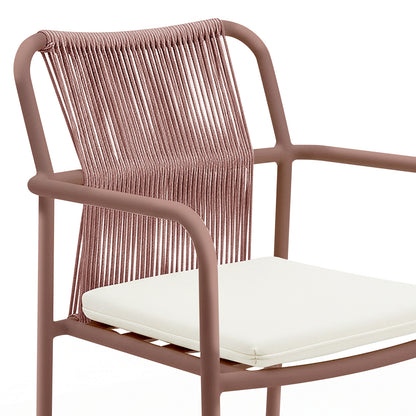 Evone Aluminium Rope Outdoor Dining Chair features a tubular metal frame, tightly strung rope backrest, and a simple white padded seat cushion, blending modern design with coastal charm for outdoor dining.