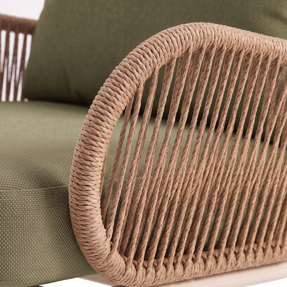 Close-up of chair armrest and cushion detail with woven rope texture