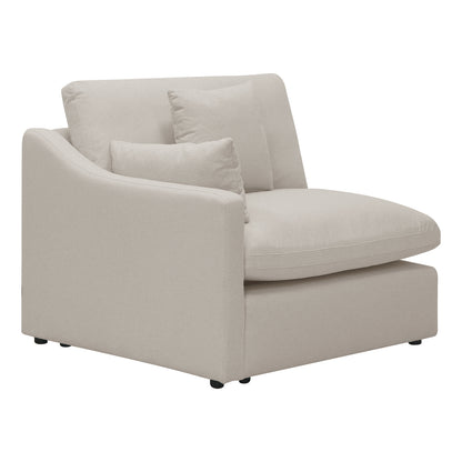 Modern beige upholstered chair with pillows on a white background