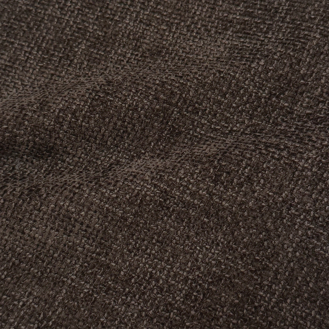 Close-up of dark brown textured fabric upholstery
