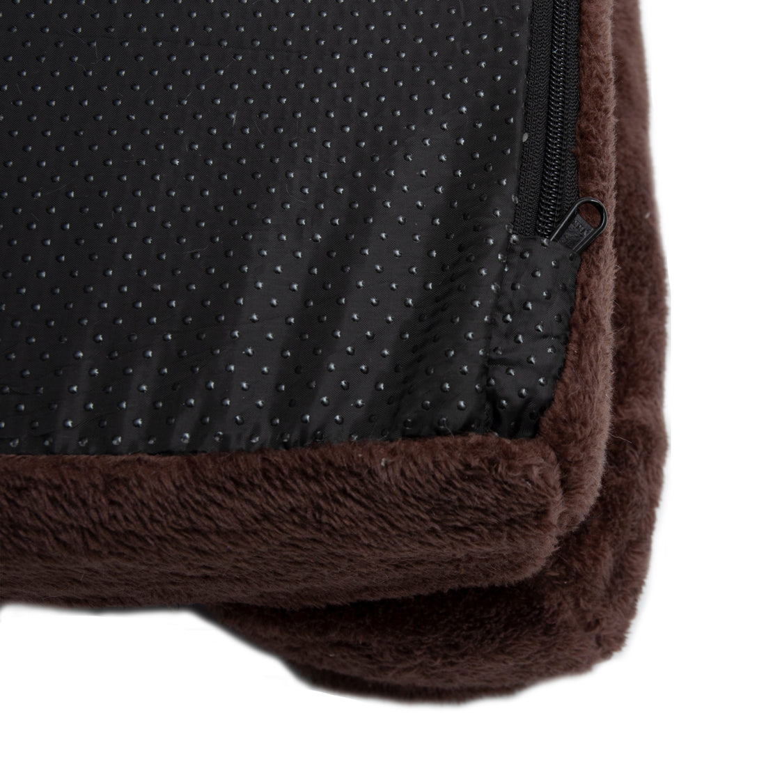 Detail of brown plush bed corner with zipper and non-slip bottom