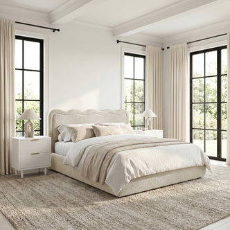 Upholstered bed in styled bedroom with neutral decor