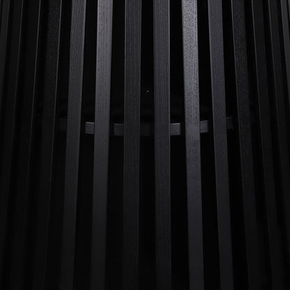 Close-up of the Riri 120cm Round Fluted Wood Dining Table in Black, featuring vertical black wooden slats forming a sleek, textured cylindrical base, highlighting its modern, sculptural design.
