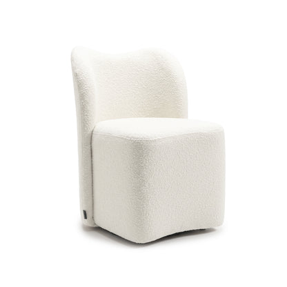 Modern white textured accent chair on a white background