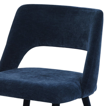 Close-up of the upper backrest and seat of a dark blue chair on white background