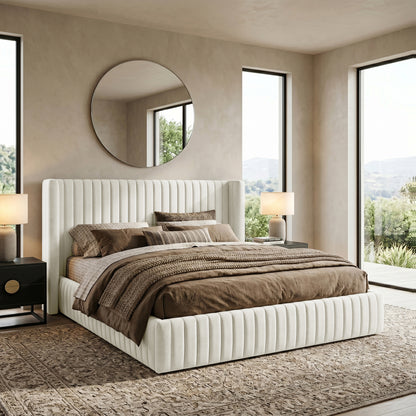 Ivory channel-tufted bed styled with bedding in a bright modern bedroom