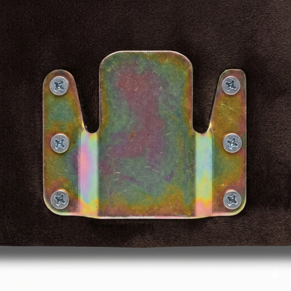 Close-up of metal mounting bracket hardware on dark fabric