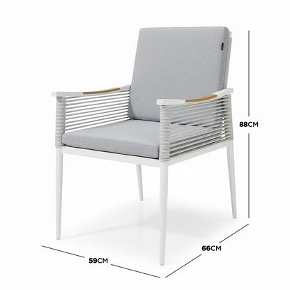 Casara 7 Piece Outdoor Dining Set in White & Grey featuring modern armchairs with powder-coated metal frames, rope detailing, and removable cushions, perfect for stylish and comfortable outdoor dining.