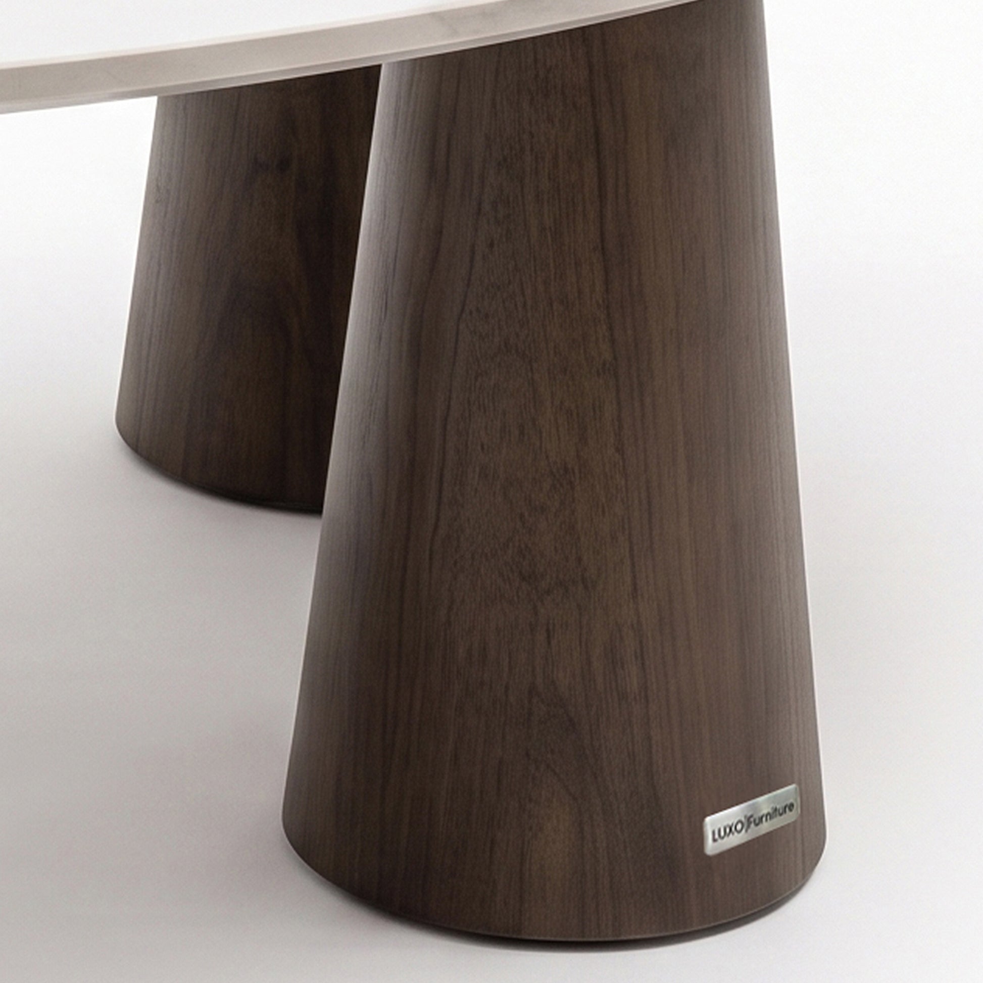 Close-up of the table base and partial tabletop on a white background