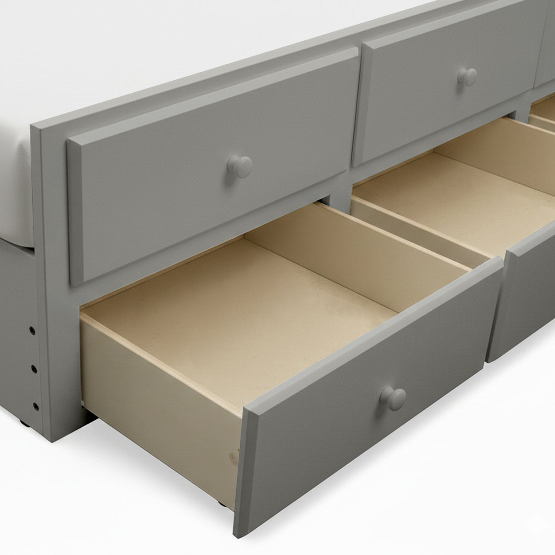 Grey bed frame with three open storage drawers showing light wood interior on white background