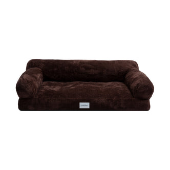 Dark brown plush pet bed with bolstered sides on white background