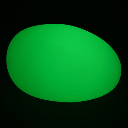 Solar Charging Outdoor LED Rock Light Waterproof Stone Lamp depicted as a smooth green oval on a black background, resembling a natural stone, designed for seamless integration into garden landscapes.