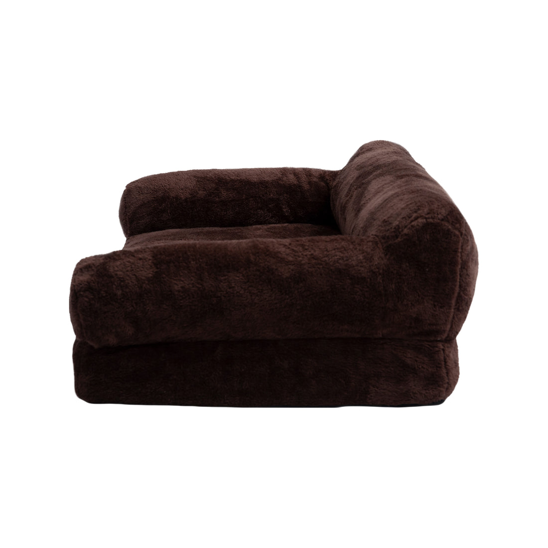 Side profile of dark brown plush furniture on white background