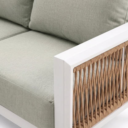 Close-up of outdoor sofa armrest with woven detail and part of the cushion