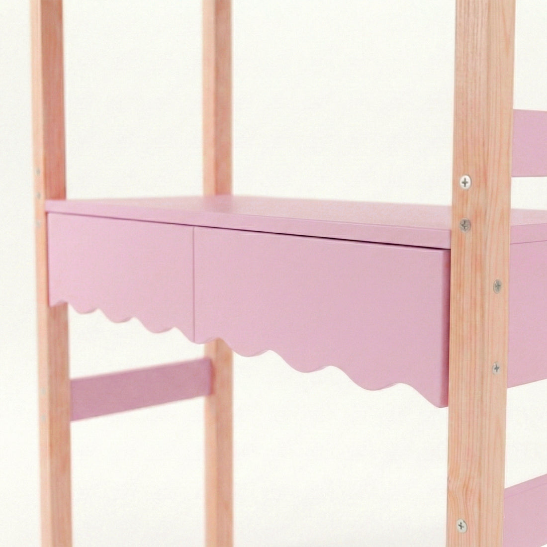 Detail view of pink scalloped shelf and natural wood supports