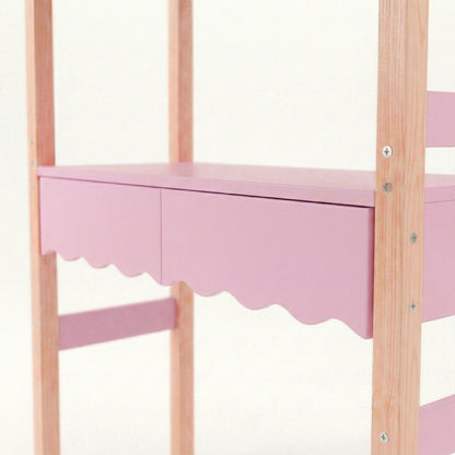 Detail view of pink scalloped shelf and natural wood supports