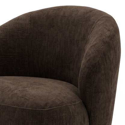 Close-up of a cocoa brown accent chair showing the seat, backrest, and part of an armrest.