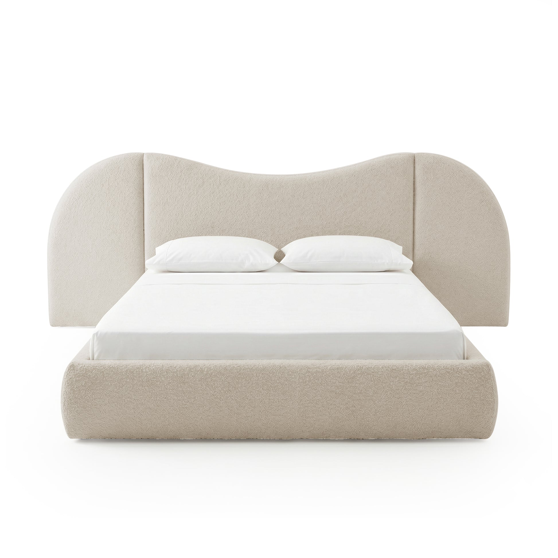 Front view of beige upholstered bed with pillows on white background