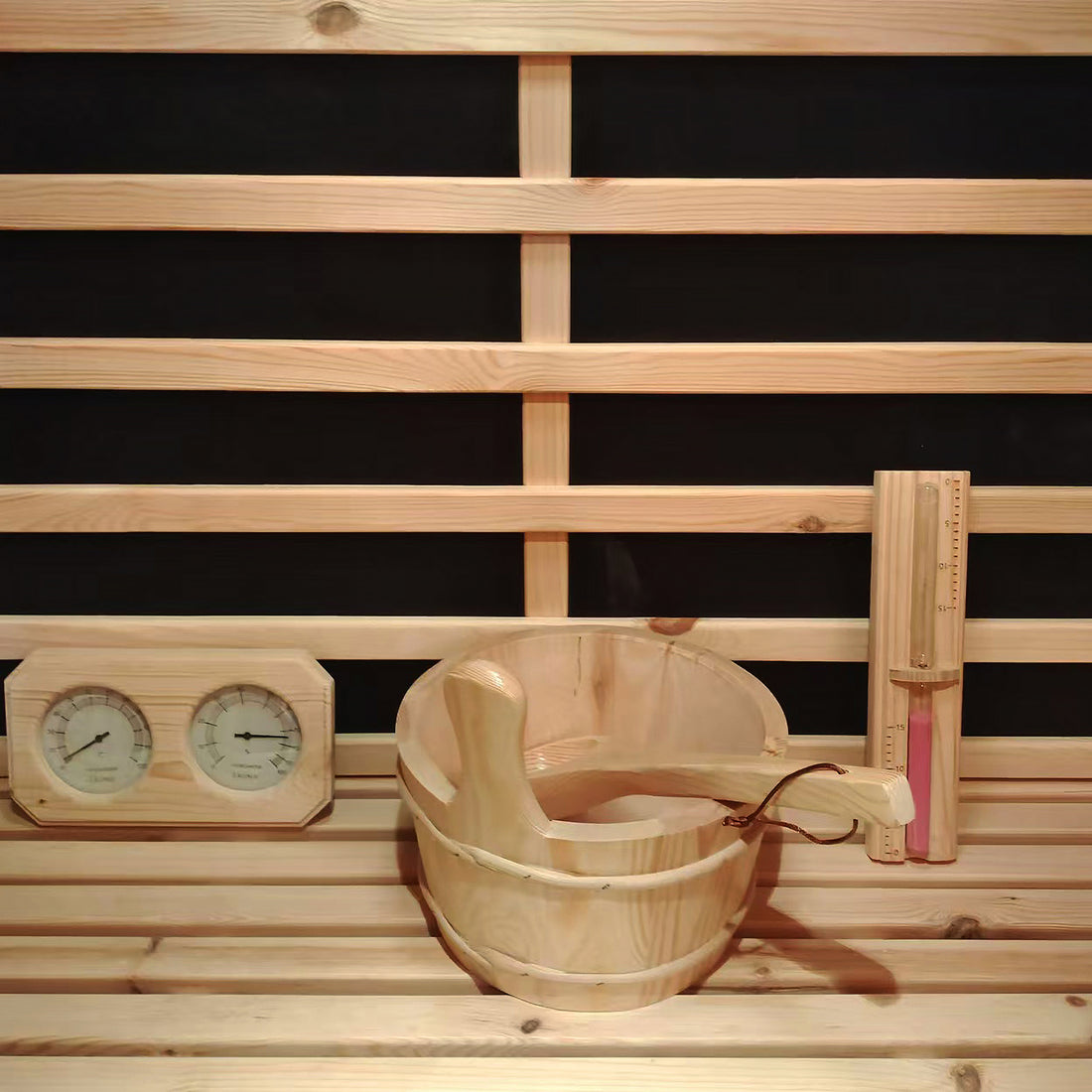 Luxo Kiima 6 Person Hybrid Finnish Outdoor Sauna in Natural features a wood-lined interior with a sauna bucket, ladle, dual gauge, and hourglass against horizontal slats, offering an authentic sauna experience.