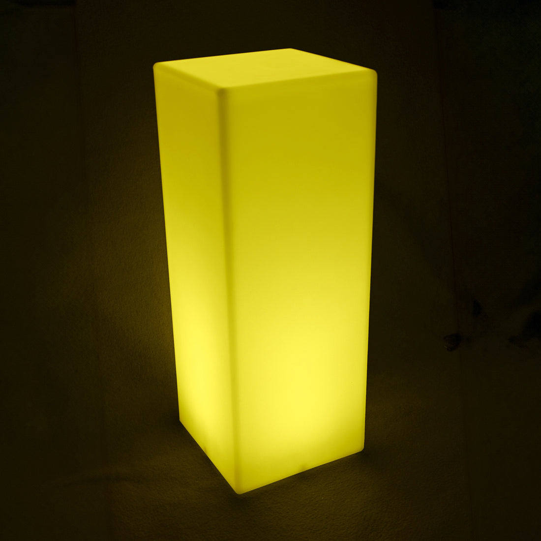 Colour Changing LED Column Light Indoor & Outdoor, a tall, block-shaped lamp emitting a soft glow, ideal for creating ambiance with adjustable colors and modes, perfect for versatile indoor or outdoor settings.