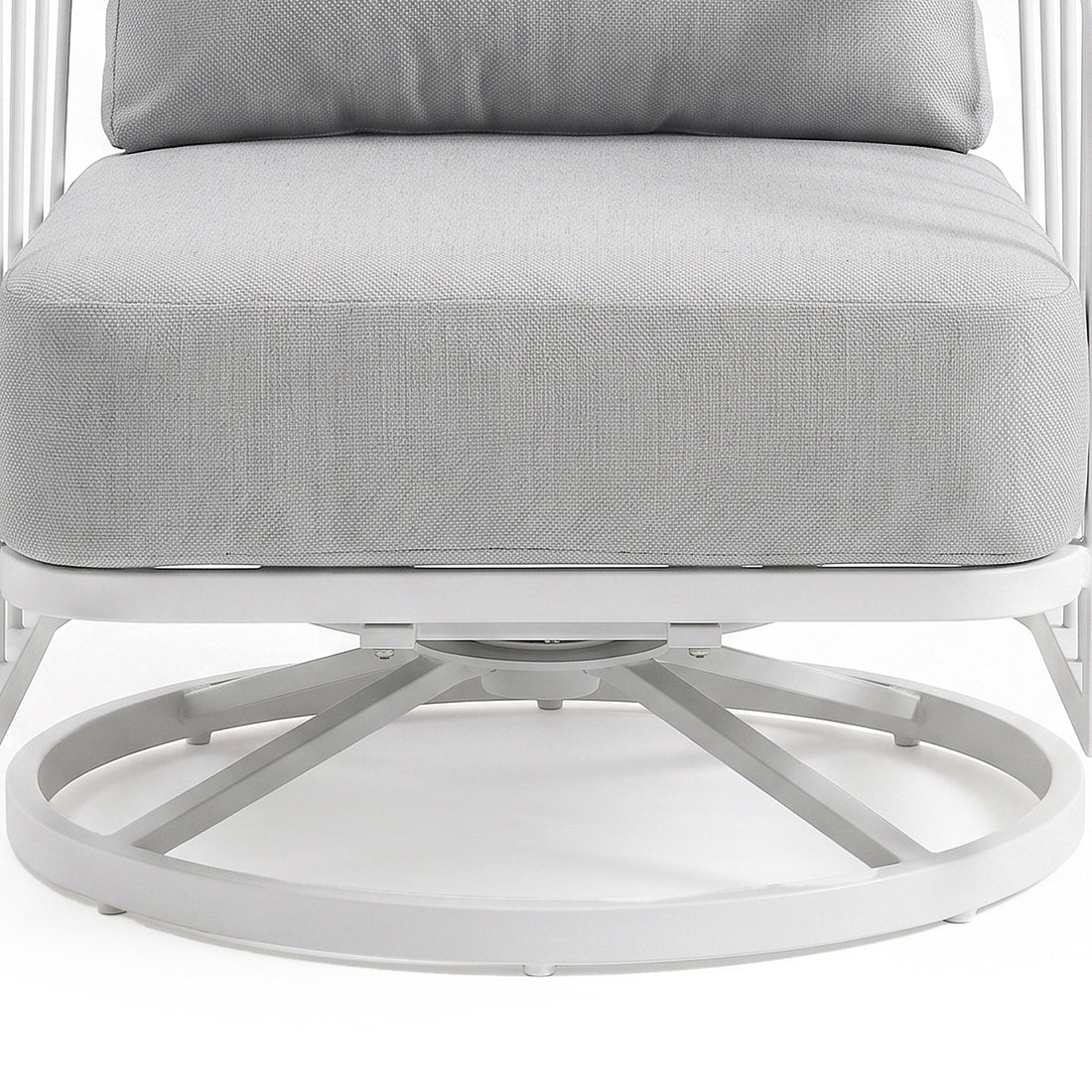 Close-up of the lower half of a cushioned chair with metal base on a white background