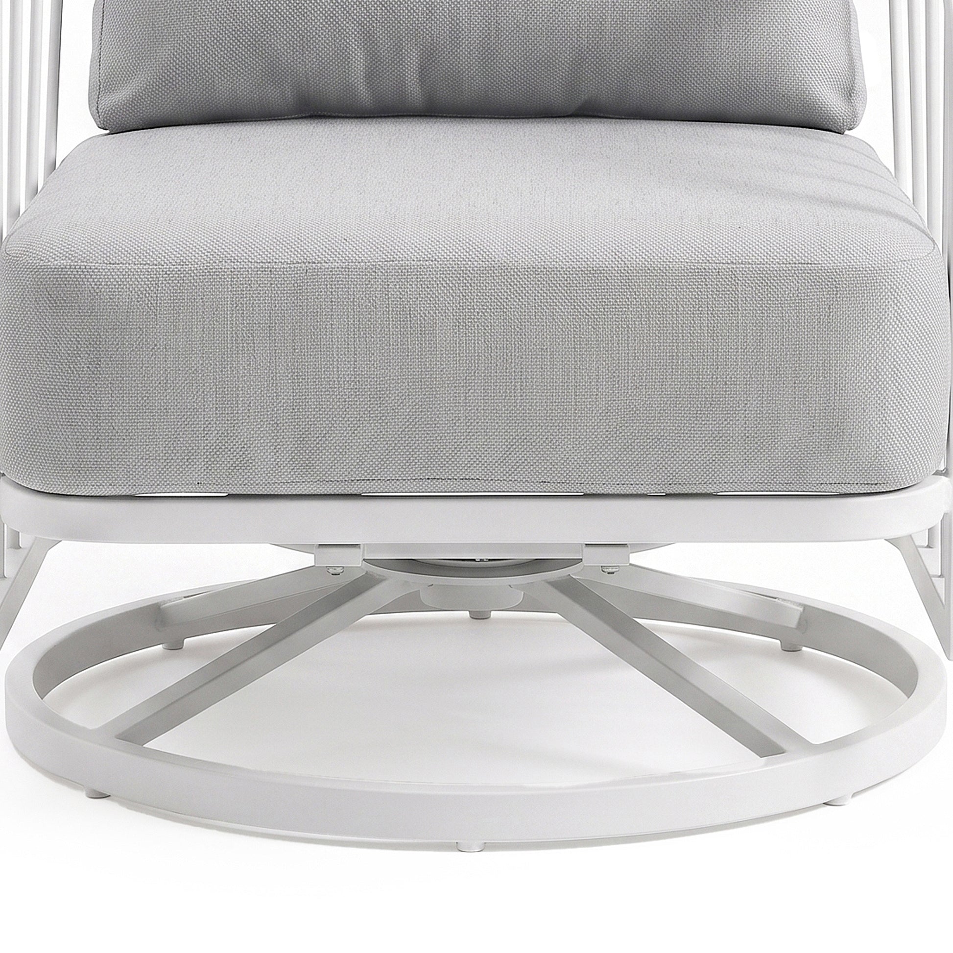 Close-up of the lower half of a cushioned chair with metal base on a white background