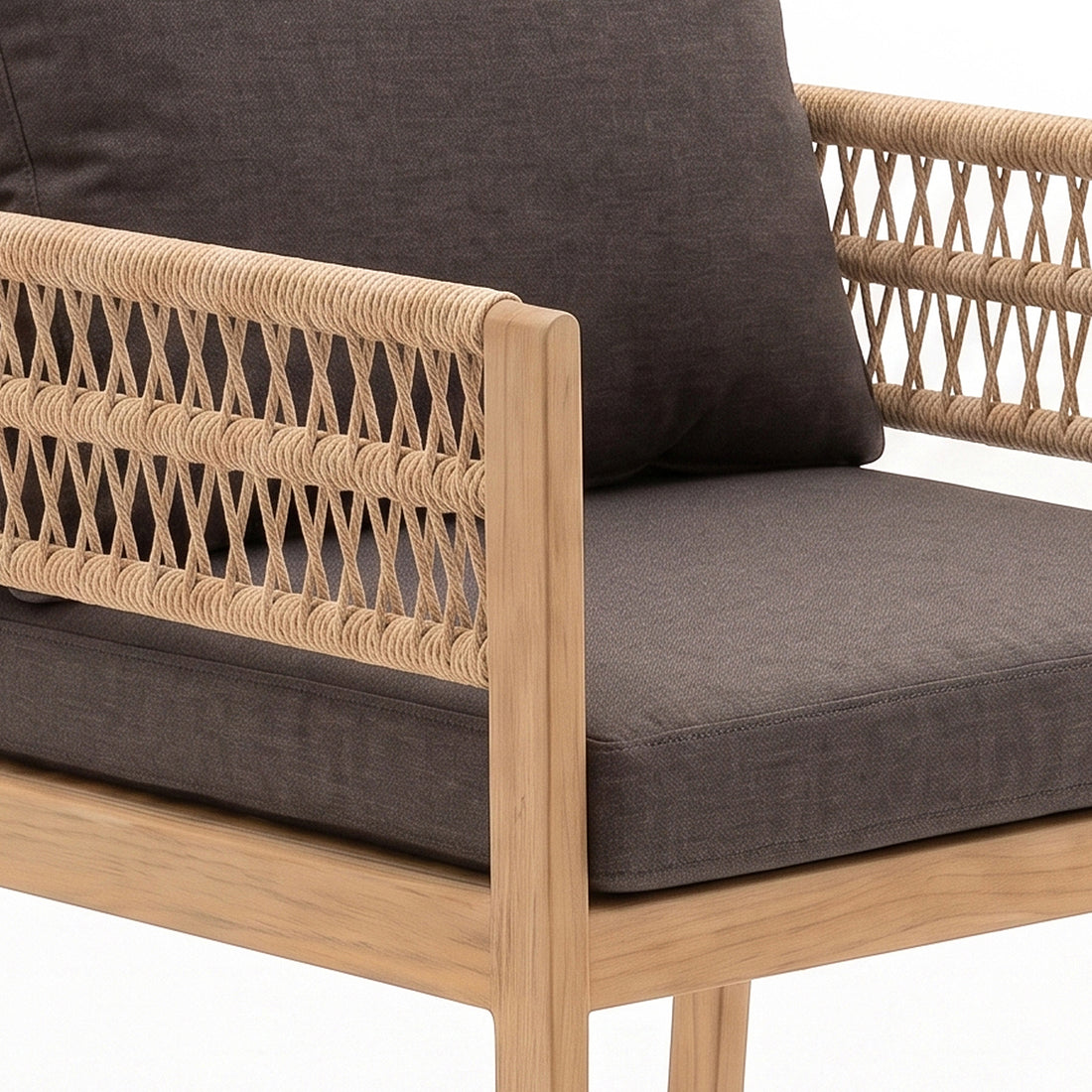 Close-up of chair arm and seat with woven detail and dark cushion