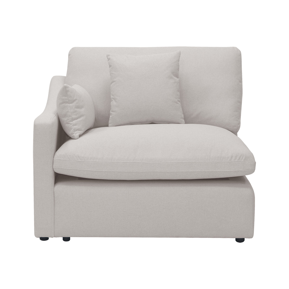 Light beige modular corner chair with plush cushions and two throw pillows on a white background