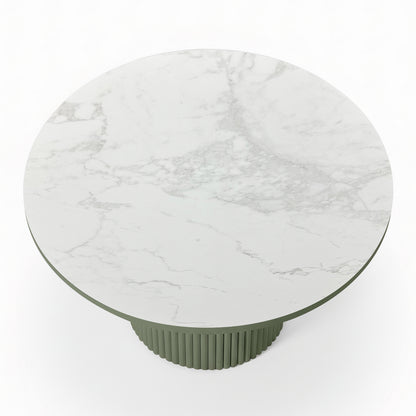 Evone 4 Seater Stone Outdoor Dining Table Set features a white marble tabletop with gray veining on a muted green, fluted pedestal base, ideal for modern outdoor dining.