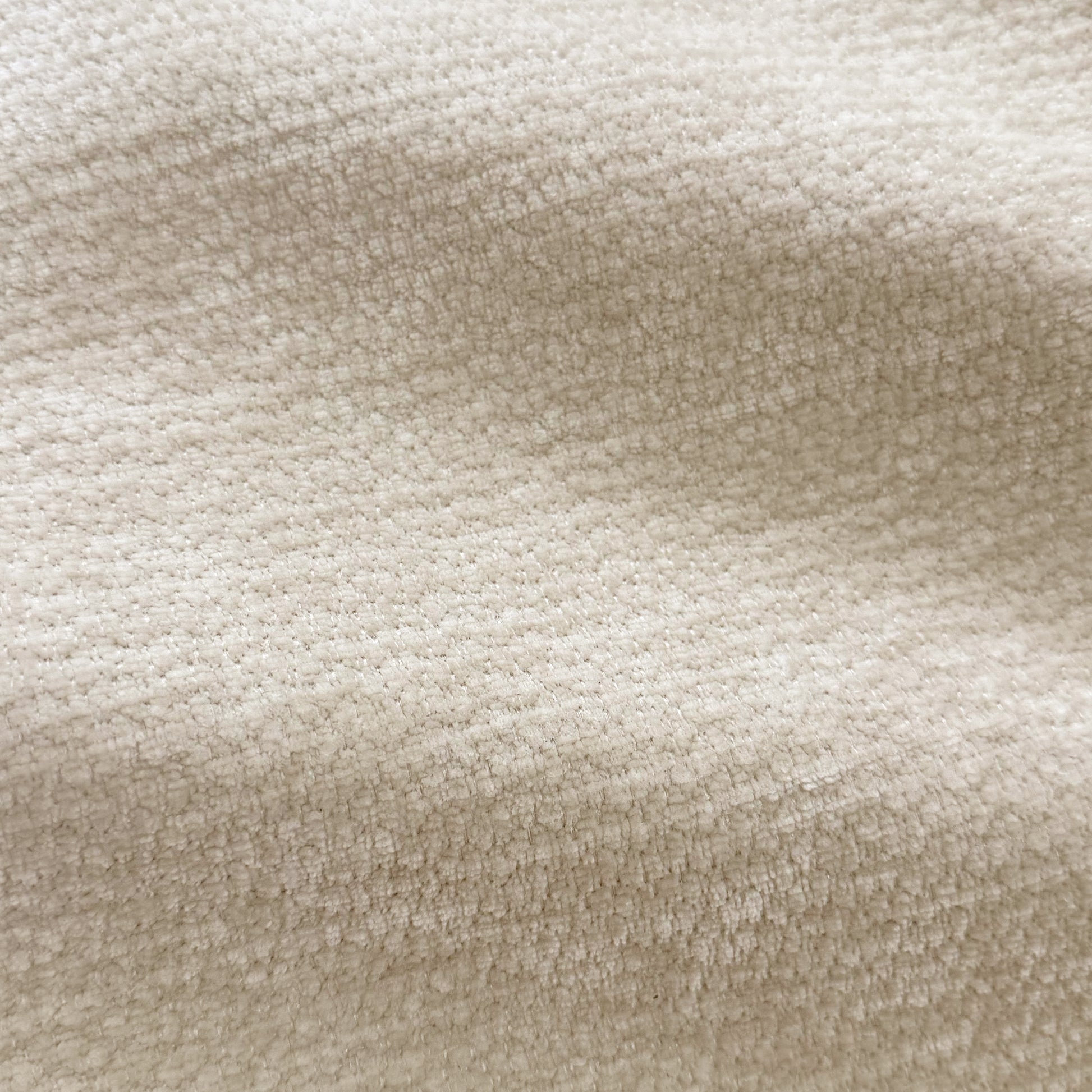 Close-up of beige upholstery fabric texture