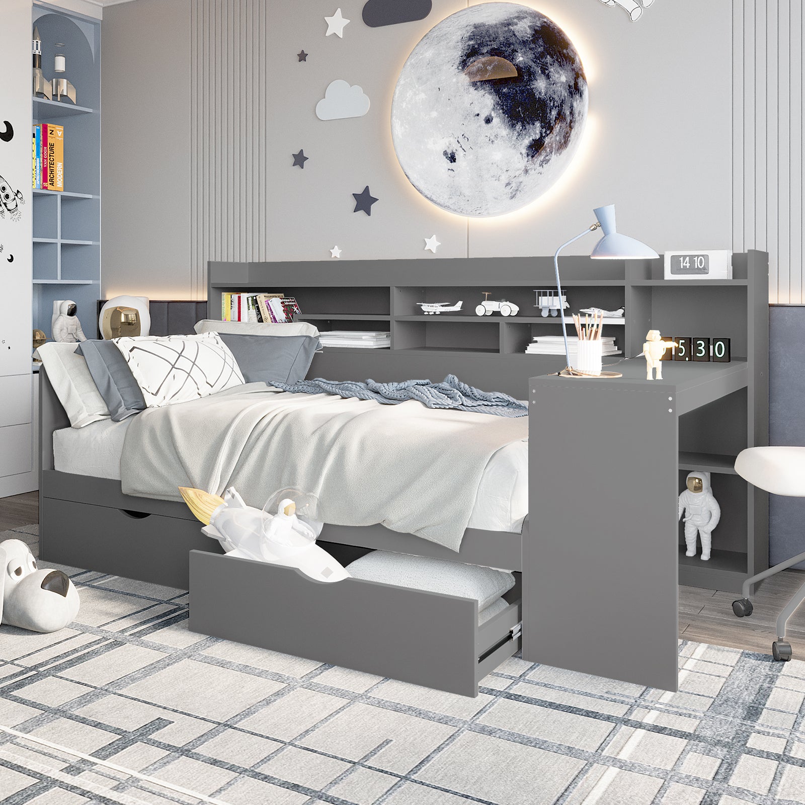 Hally Storage Single Bed with Desk and Drawers in Grey features a daybed with storage, desk, and shelving, complemented by space-themed decor, ideal for organized study and play areas in compact rooms.